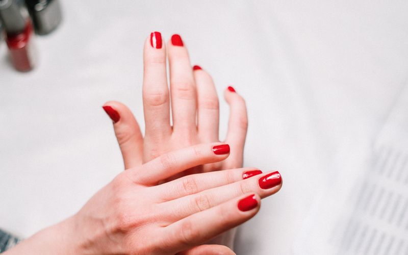 Freshly painted red manicure